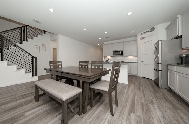 dining room with light hardwood / wood-style floors