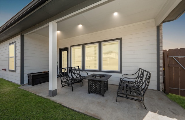 patio terrace at dusk with an outdoor fire pit