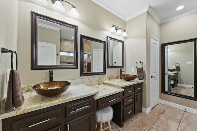 bathroom with ornamental molding, tile patterned flooring, and vanity