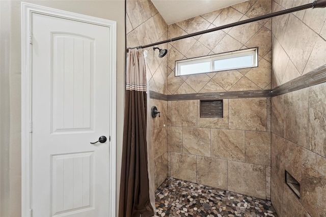 bathroom with curtained shower