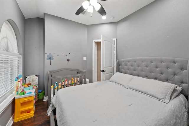 bedroom featuring dark hardwood / wood-style floors and ceiling fan