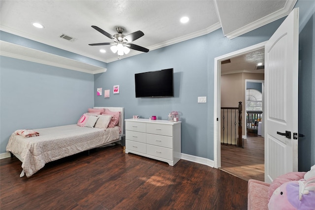 bedroom featuring dark wood-type flooring, ornamental molding, and ceiling fan