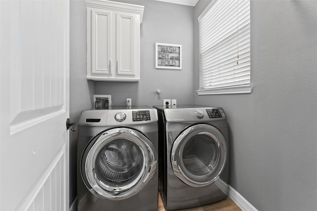 laundry room with cabinets and independent washer and dryer