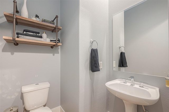 bathroom with sink and toilet