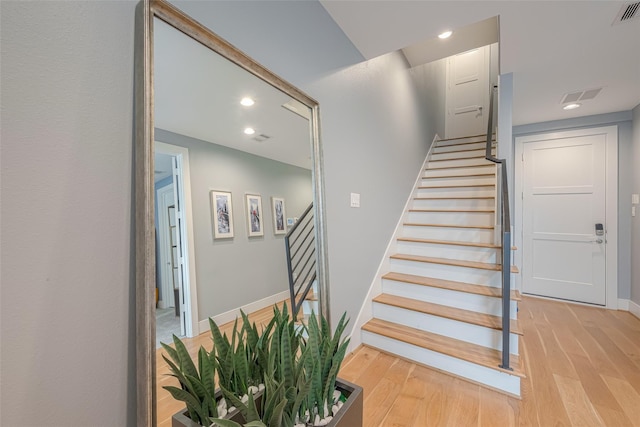 staircase featuring hardwood / wood-style floors