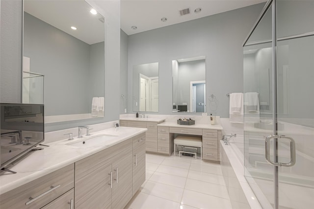 bathroom featuring vanity, tile patterned floors, and shower with separate bathtub