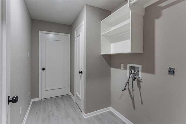 washroom featuring electric dryer hookup, washer hookup, and light hardwood / wood-style floors