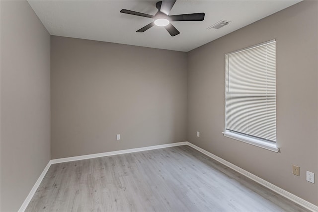 spare room with light hardwood / wood-style flooring and ceiling fan