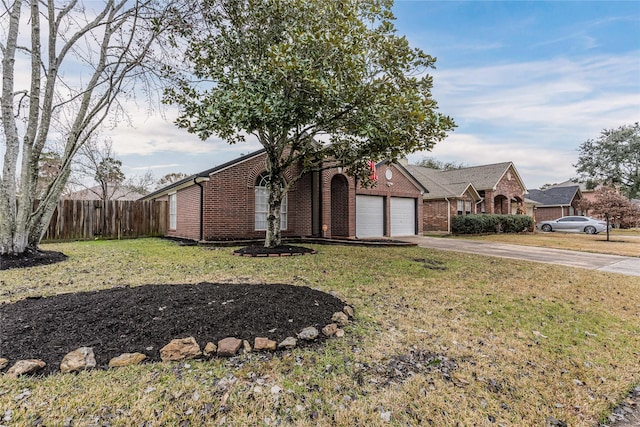 view of front facade with a garage and a front lawn