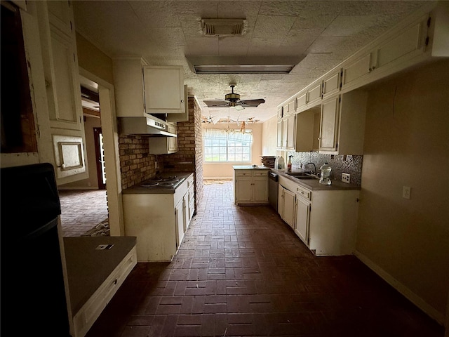 kitchen with electric stovetop, under cabinet range hood, a sink, visible vents, and dishwasher