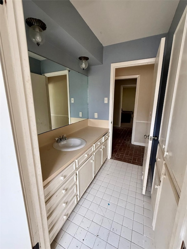 bathroom with tile patterned flooring and vanity