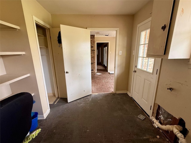 entryway featuring baseboards