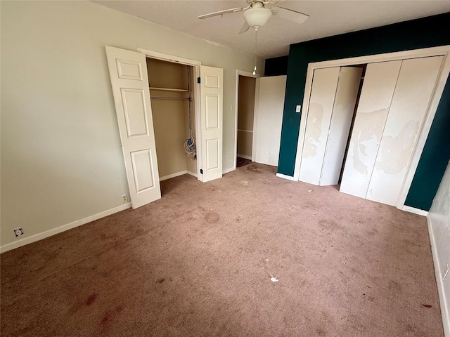 unfurnished bedroom with carpet flooring, a ceiling fan, and baseboards