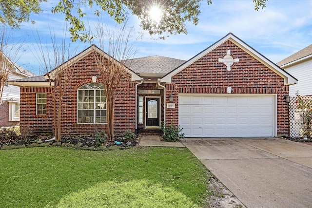 view of front property featuring a garage and a front yard