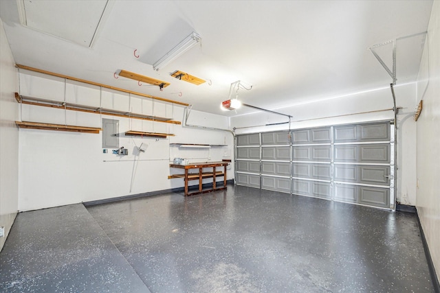 garage featuring a garage door opener and electric panel