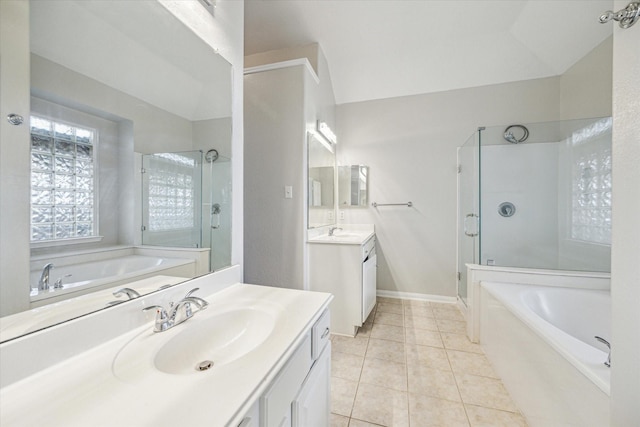 bathroom with independent shower and bath, vanity, and tile patterned floors