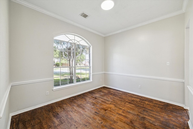 spare room with crown molding and dark hardwood / wood-style floors