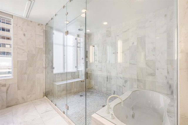 bathroom featuring tile walls and shower with separate bathtub