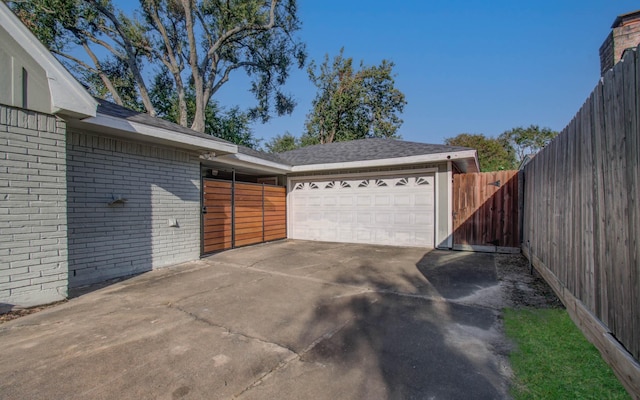 view of side of property with a garage