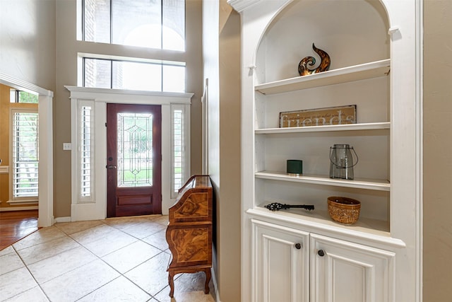 foyer entrance with light tile patterned floors