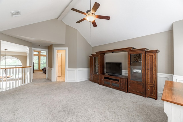 unfurnished living room with lofted ceiling with beams, light carpet, and ceiling fan