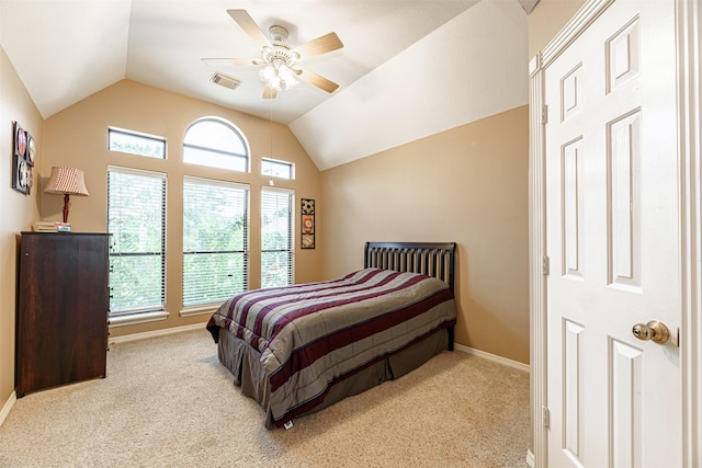 carpeted bedroom with vaulted ceiling and ceiling fan