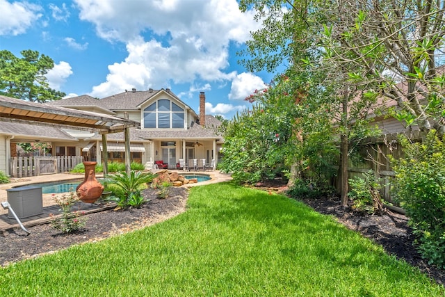 back of house with a patio, a yard, and ceiling fan