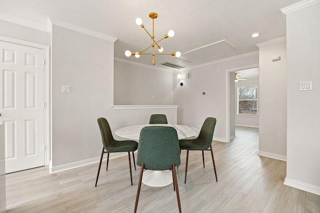 dining area with ornamental molding, a textured ceiling, and light wood-type flooring