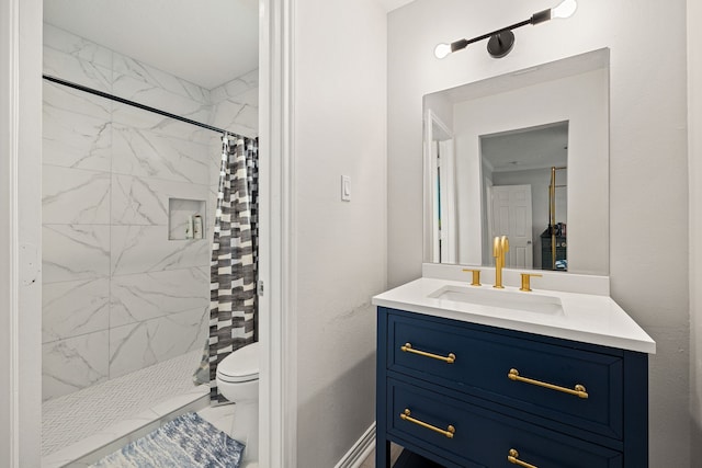 bathroom with vanity, toilet, and curtained shower