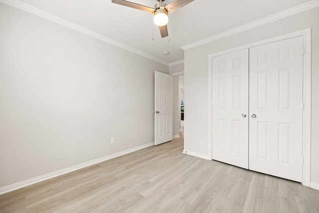 unfurnished bedroom with ornamental molding, a closet, ceiling fan, and light hardwood / wood-style flooring