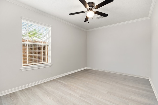 empty room featuring crown molding, ceiling fan, light hardwood / wood-style floors, and a textured ceiling