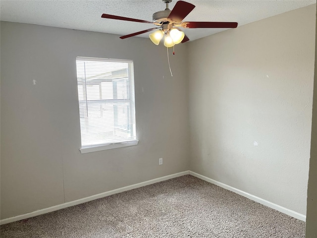 unfurnished room featuring ceiling fan, carpet, and a textured ceiling