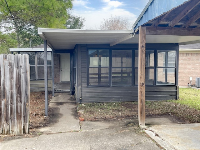 exterior space featuring a sunroom