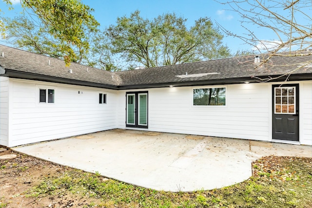 back of property featuring a patio