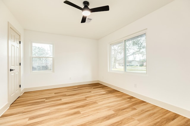 spare room featuring ceiling fan and light hardwood / wood-style flooring