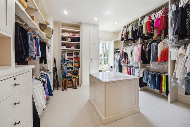 spacious closet with light carpet