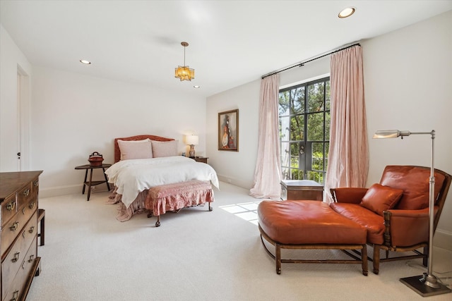 bedroom with light colored carpet