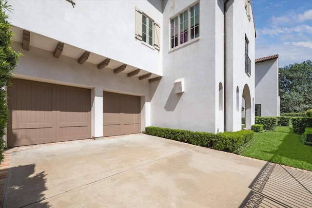 view of side of home featuring a garage