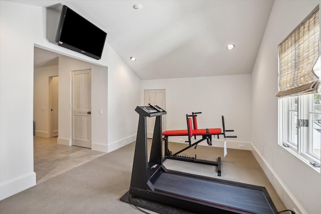 workout area with light colored carpet and lofted ceiling