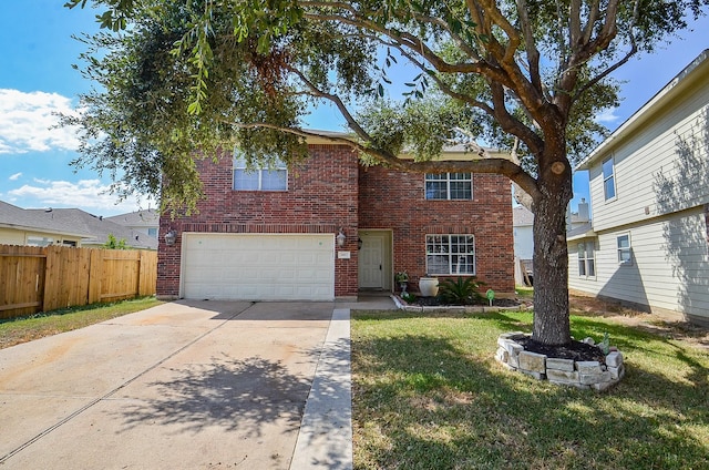 view of front of house with a garage and a front yard