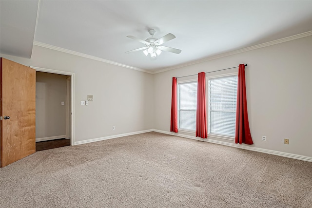 unfurnished room with crown molding, carpet floors, and ceiling fan