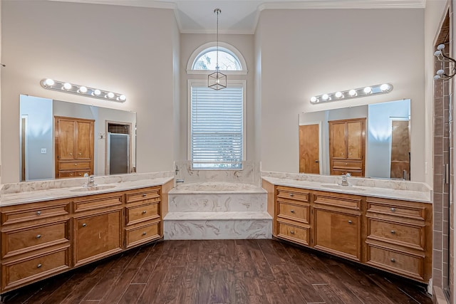 bathroom with crown molding, vanity, plus walk in shower, hardwood / wood-style floors, and a high ceiling