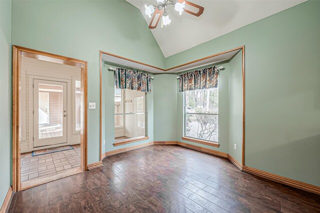 unfurnished room with ceiling fan, dark hardwood / wood-style flooring, and high vaulted ceiling