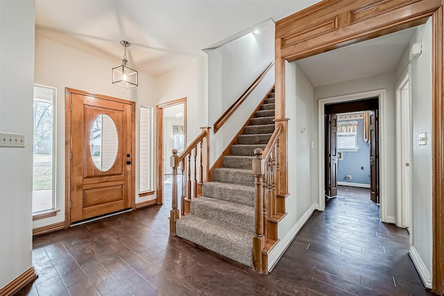 entrance foyer featuring dark hardwood / wood-style floors