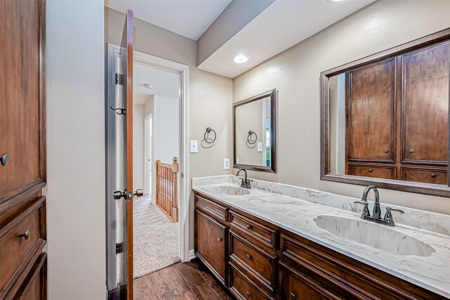 bathroom with vanity and hardwood / wood-style floors