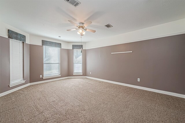 unfurnished room with carpet floors and ceiling fan