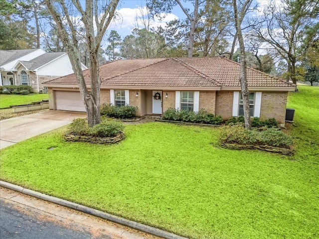 single story home with a garage and a front yard