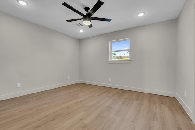 unfurnished room with light wood-style floors, recessed lighting, visible vents, and baseboards