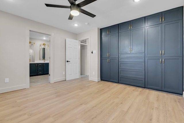 unfurnished bedroom featuring recessed lighting, connected bathroom, light wood-style flooring, and baseboards