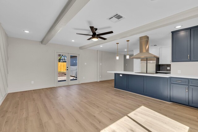 kitchen featuring island range hood, hanging light fixtures, beamed ceiling, ceiling fan, and light hardwood / wood-style floors